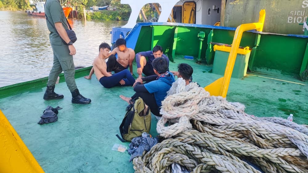 Some of the rowers who managed to swim to safety. — Picture courtesy of the Fire and Rescue Department