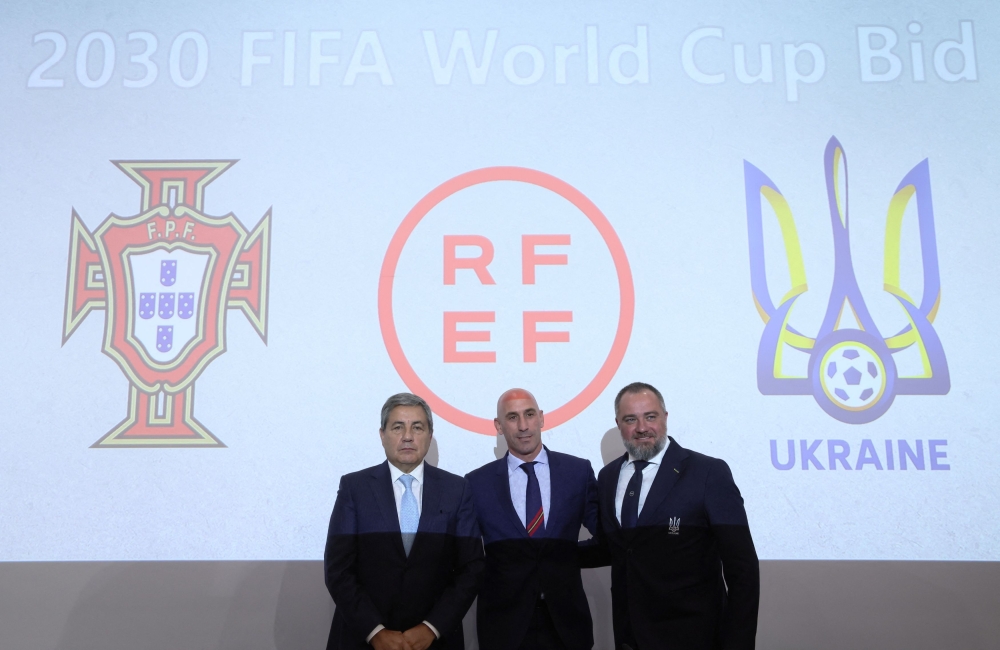Luis Rubiales (centre) pose with Spanish football Federation president Portuguese Football Federation president Fernando Gomes (left) and Ukrainian Association of Football president Andriy Pavelko during a press conference at Uefa’s headquarters in Nyon October 5, 2022. — Reuters pic
