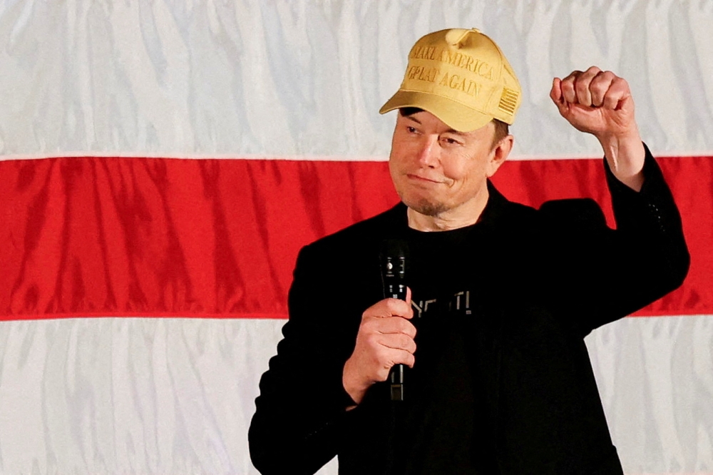 Tesla CEO and X owner Elon Musk, who supports Republican presidential nominee former U.S. President Donald Trump, gestures as he speaks about voting during an America PAC Town Hall in Folsom, Pennsylvania, U.S., October 17, 2024. — Reuters pic