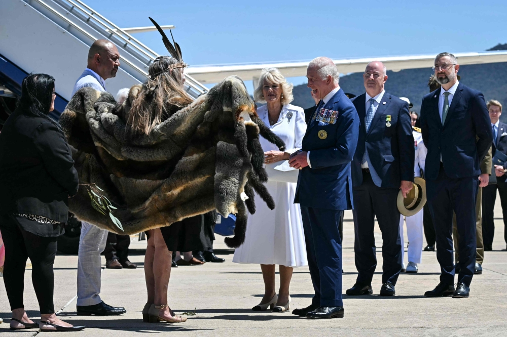 Britain's King Charles III and Queen Camilla are greeted by Ngunnawal Elder Aunty Serena Williams at Defence Establishment Fairbairn in Canberra on October 21, 2024, during a six-day royal visit to Sydney and Canberra. — AFP pic