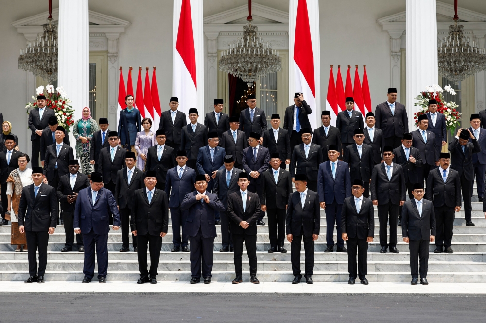 esian President Prabowo Subianto, Vice President Gibran Rakabuming Raka, and newly appointed cabinet ministers prepare for group photos after the inauguration of the new cabinet, at the Presidential Palace in Jakarta, Indonesia, October 21, 2024. — Reuters pic