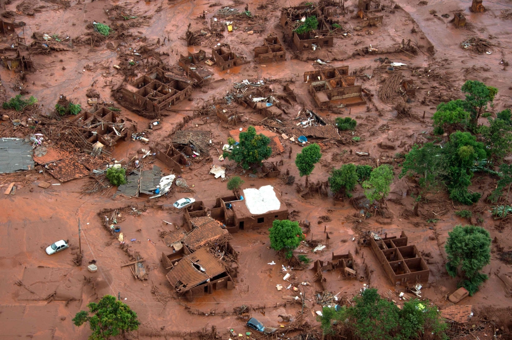 File picture of an aerial view taken on November 6, 2015, shows the mud-covered village of Bento Rodrigues, in Mariana, the south-eastern Brazilian state of Minas Gerais, following a dam burst, at a mining waste site, of the company Samarco, jointly owned by Vale of Brazil and BHP, unleashing a deluge of thick, red toxic mud. — AFP pic 