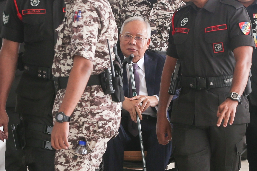 A file photograph shows Datuk Seri Najib Razak arriving at the Kuala Lumpur Court Complex on October 3, 2024. — Picture by Yusof Mat Isa
