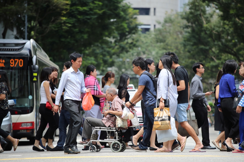 Got hands occupied or just find it icky to press buttons? Singapore is shifting towards touch-free motion sensors at pedestrian crossings for hygiene and convenience. — Reuters pic