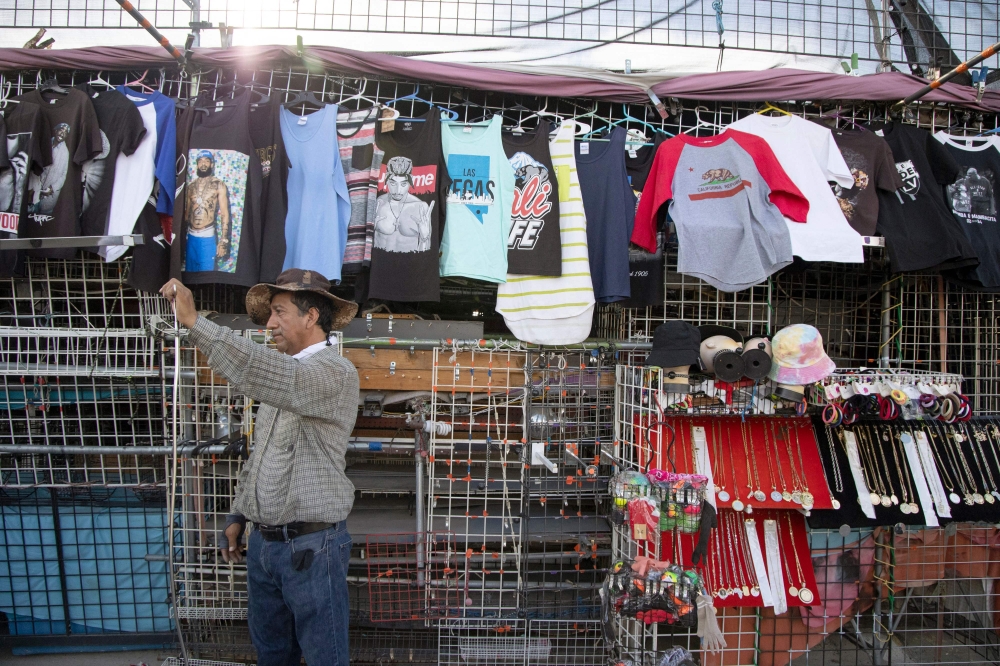 Carlos Reyes, 57, pauses work outside his booth at Broadacres Marketplace in North Las Vegas, Nevada, on October 11, 2024. Latinos are the second-largest ethnic group in the United States, and represent 22 percent of voters in Nevada. — AFP pic