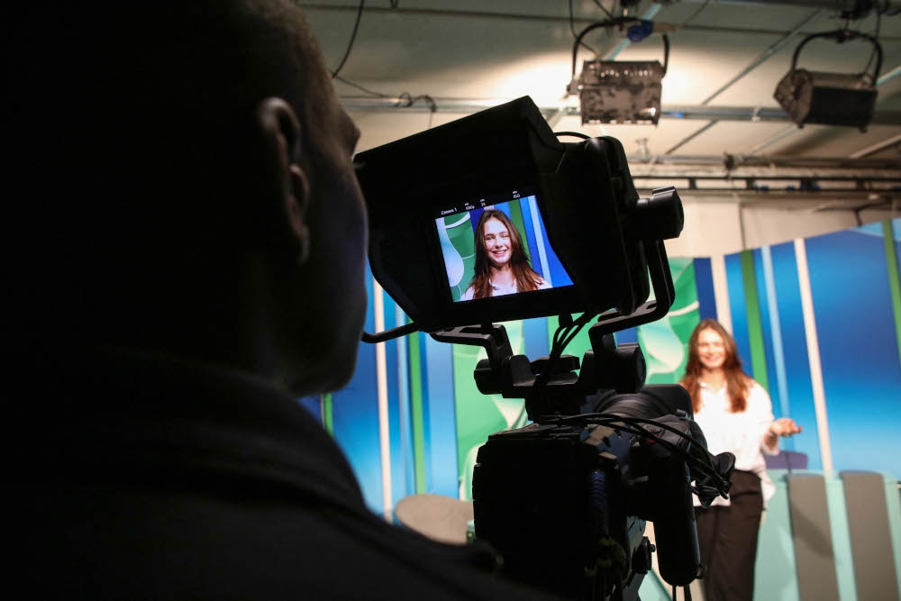 Czech Republic student, 19-year-old Denisa Lacinova is pictured through the monitor of a camera in the media room at the South East Technological University (SETU) in Carlow, eastern Ireland on September 24, 2024, where a new course has started in Content Creation and Social Media. — AFP pic 