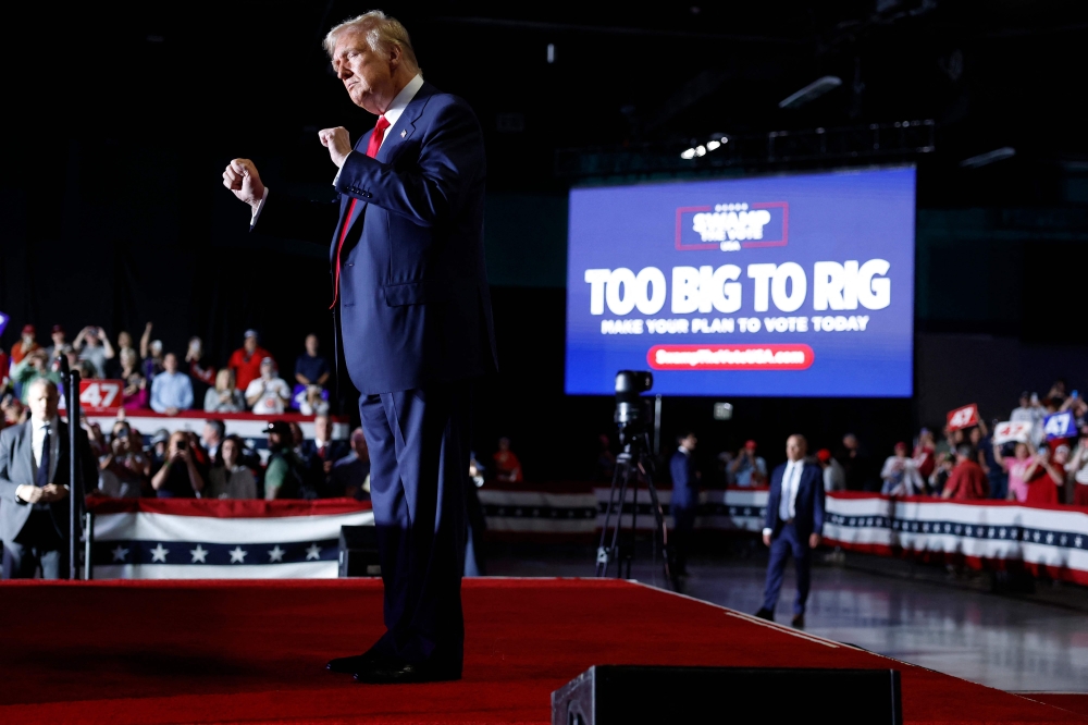 Republican presidential nominee, former U.S. President Donald Trump dances on stage after speaking at a campaign rally at the Greensboro Coliseum on October 22, 2024 in Greensboro, North Carolina. — AFP pic
