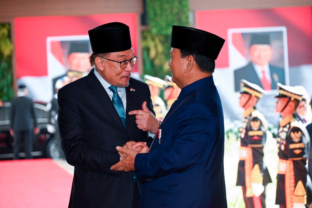 Prime Minister Datuk Seri Anwar Ibrahim (left) congratulates Prabowo Subianto on his appointment as the new President of Indonesia October 20, 2024. — Bernama pic