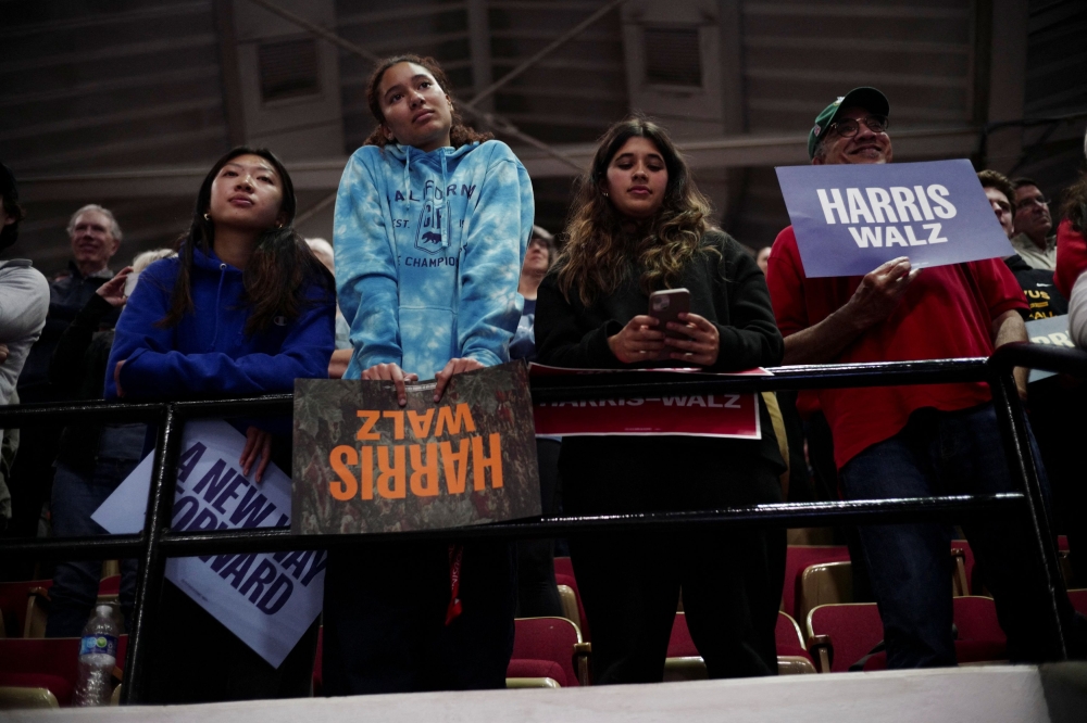People attend a campaign event with Democratic vice presidential nominee, Minnesota Gov. Tim Walz, and former U.S. President Barack Obama gathering support for Democratic presidential nominee and U.S. Vice President Kamala Harris in Madison, Wisconsin, U.S. October 22, 2024. — Reuters pic