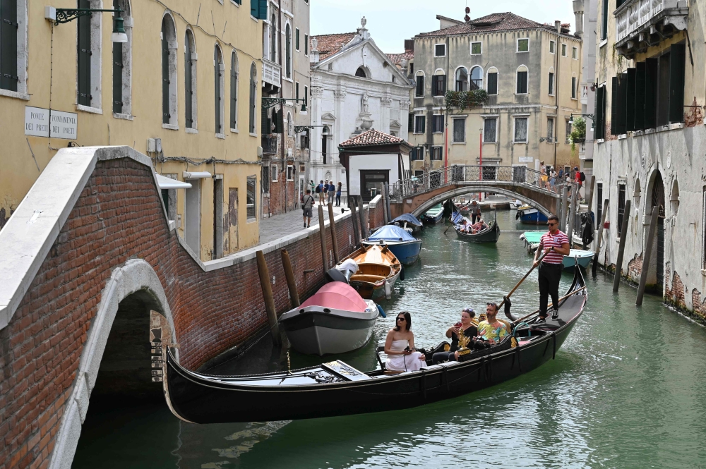 Venice Mayor Luigi Brugnaro said the tourist fee charges will start from April 18, 2025 and be active on 54 specific days. — AFP pic