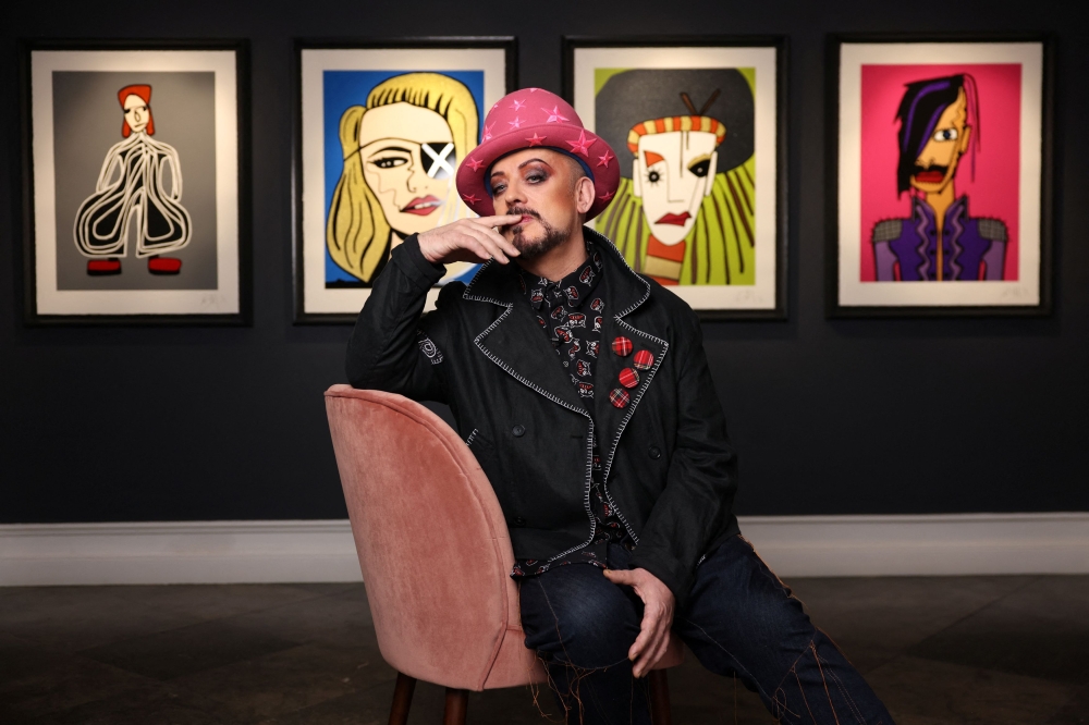Boy George poses in front of his artworks at Castle Fine Art in London, Britain, October 23, 2024. — Reuters pic 