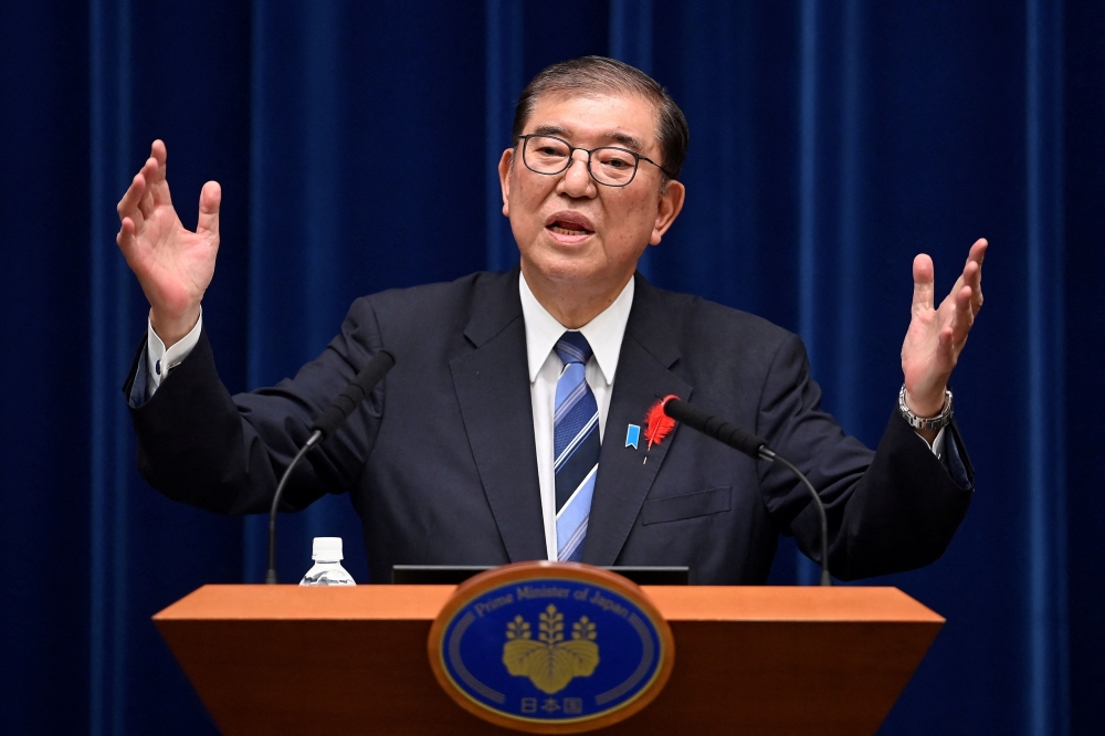 A fresh survey suggested that Ishiba’s ruling coalition could fall short of a majority in elections on Sunday. — AFP pic