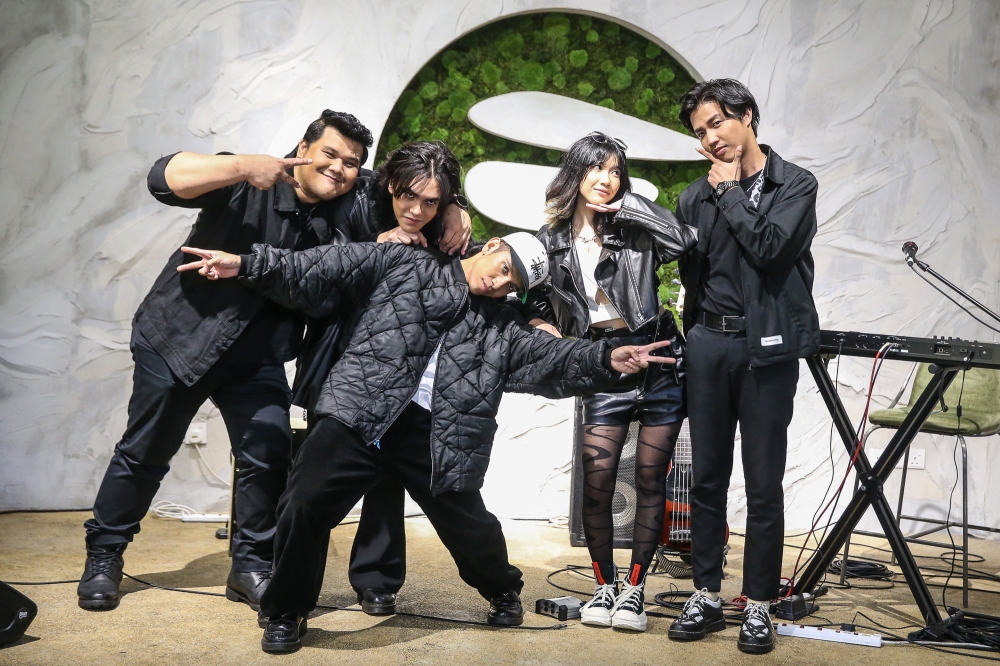Naim Daniel's MUAH! band members from left to right: Keyboardist Ayai guitarist Zenith, frontman Naim, bassist Tasneem and drummer Mairil. — Picture by Yusof Mat Isa