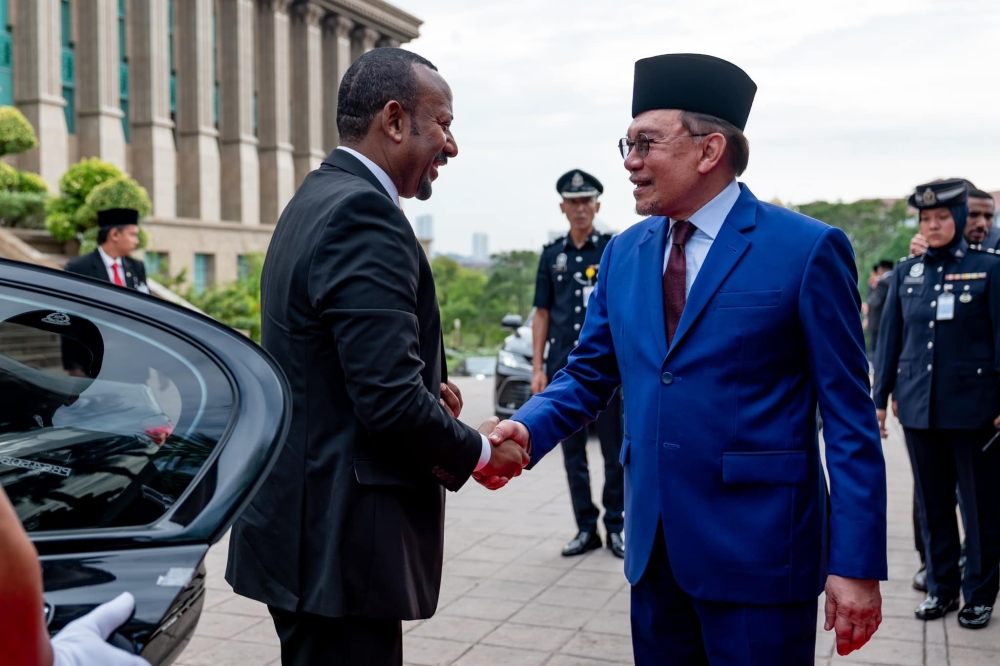 Prime Minister Datuk Seri Anwar Ibrahim received Ethiopian Prime Minister Abiy Ahmed Ali at the venue at 9.30am, before the national anthems of both countries were played.— Picture via Facebook/Anwar Ibrahim