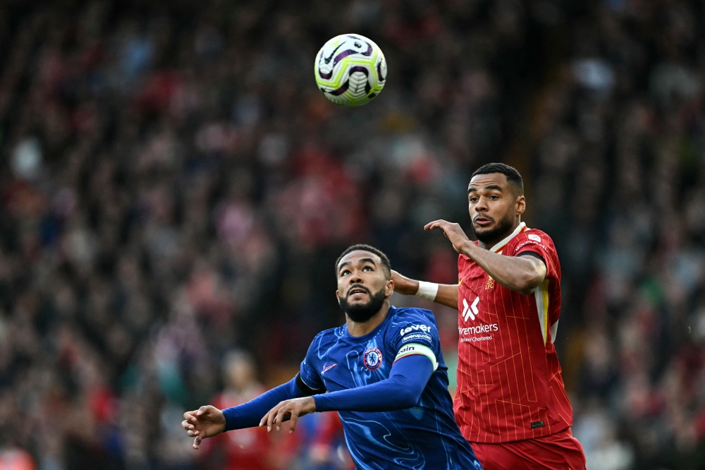 Chelsea’s Reece James and Liverpool’s Cody Gakpo vie for the ball during their English Premier League match at Anfield in Liverpool October 20, 2024. — AFP pic