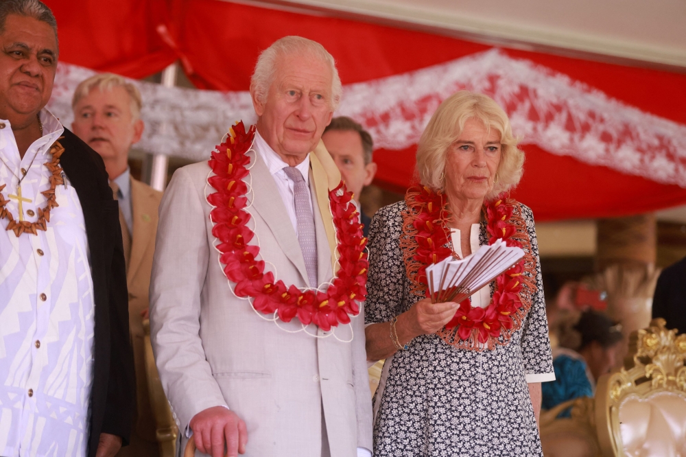 Britain's King Charles and Queen Camilla attend a ceremony on the final day of the royal visit to Australia and Samoa, in Siumu village, Samoa October 26, 2024. — Ian Vogler/Pool/AFP pic 