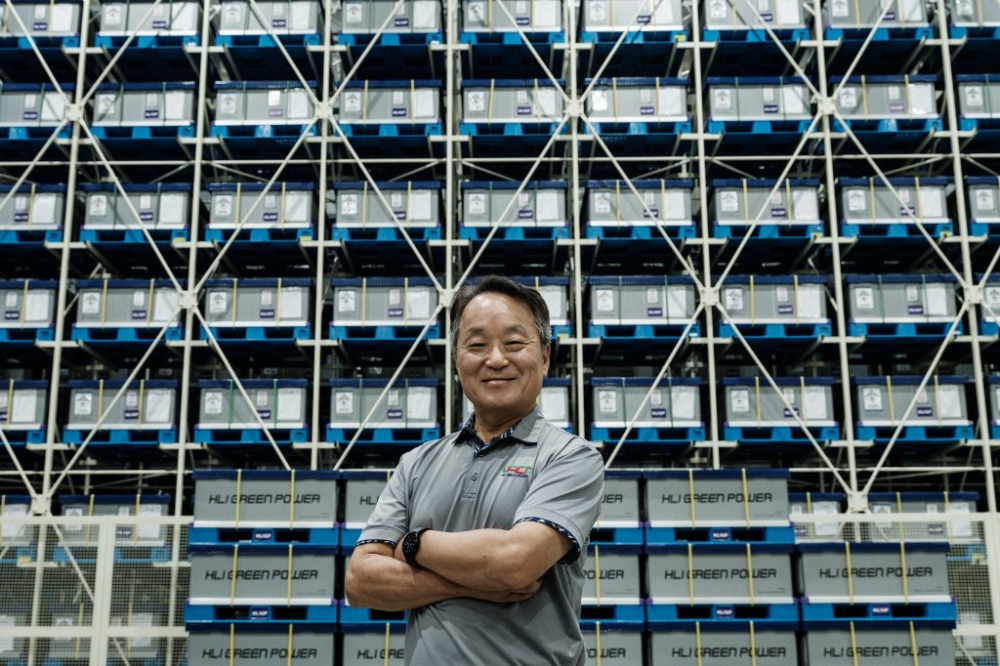 Hong Woo-pyoung, President Director of PT HLI Green Power, poses in front of boxes of battery cells to be shipped at the battery manufacturing plant at PT HLI Green Power, Indonesia’s first electric vehicle battery cell manufacturer, in Karawang. — AFP pic