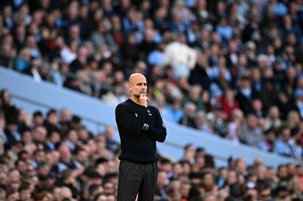 Pep Guardiola looks on from the sidelines during the English Premier League match between Manchester City and Southampton in Manchester October 26, 2024. — AFP pic