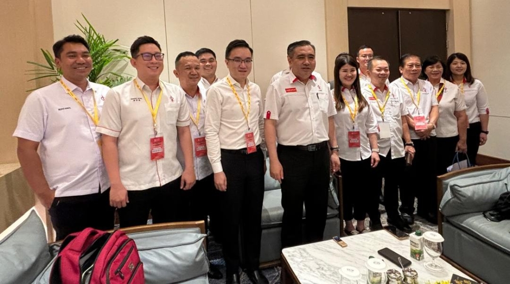 Transport Minister Anthony Loke with DAP Sabah’s leaders after the press conference today. — The Borneo Post pic