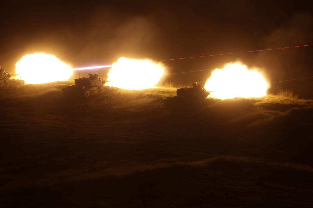Live rounds are fired during a nighttime exercise on Penghu Islands, Taiwan October 24, 2024. — Reuters pic