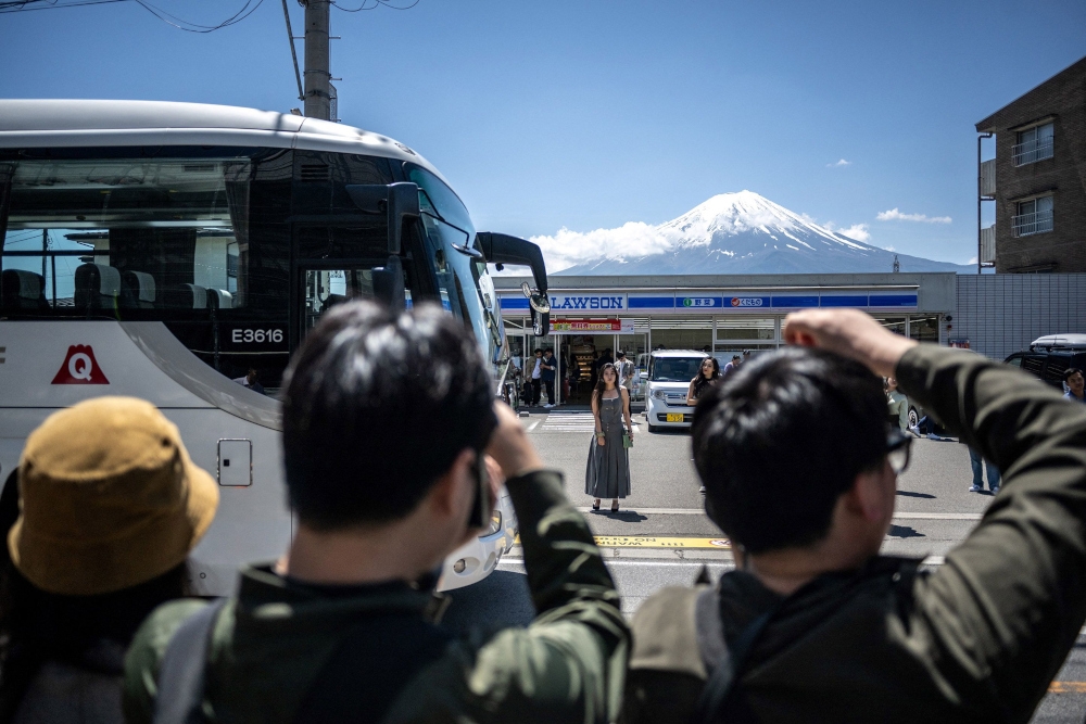 Japan’s summer this year was the joint hottest on record—equalling the level seen in 2023 -- as extreme heatwaves fuelled by climate change engulfed many parts of the globe. — File pic via AFP