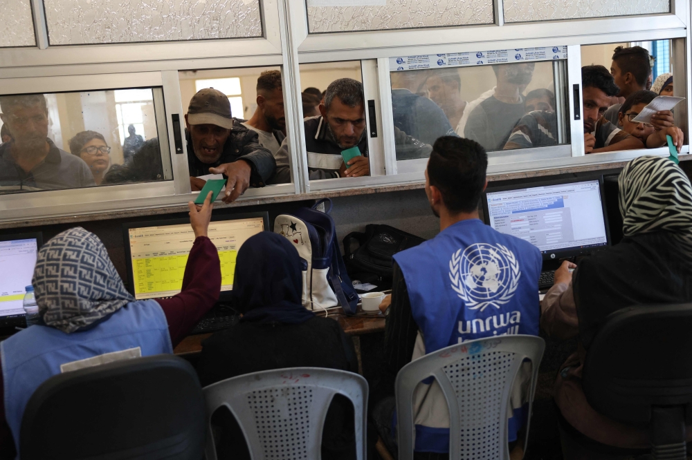 Palestinians queue to receive medicine at the UNRWA Japanese Health Center in Khan Yunis on the southern Gaza Strip on October 29, 2024, amid the ongoing war between Israel and the Palestinian militant group Hamas. — AFP pic