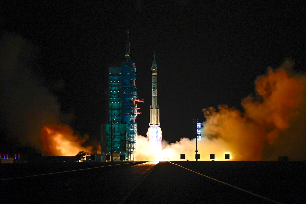 Three Chinese astronauts including the country’s only woman spaceflight engineer blasted off on a dream mission to the Tiangong space station in the early hours of Wednesday. — AFP pic