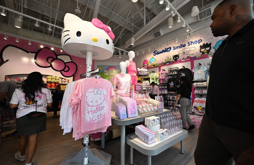 In this picture taken on September 6, 2024, people enter the Sanrio Smile Shop on its opening day at Universal Studios Hollywood in Universal City, California. Hello Kitty marks its 50th anniversary on November 1, adorning everything from handbags to rice cookers and raking in billions of dollars for her Japanese creators Sanrio. — AFP pic