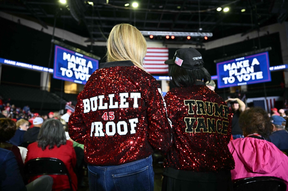 Supporters of former US President and Republican presidential candidate Donald Trump arrive for a campaign rally at the PPL Center in Allentown, Pennsylvania, on October 29, 2024. — AFP pic