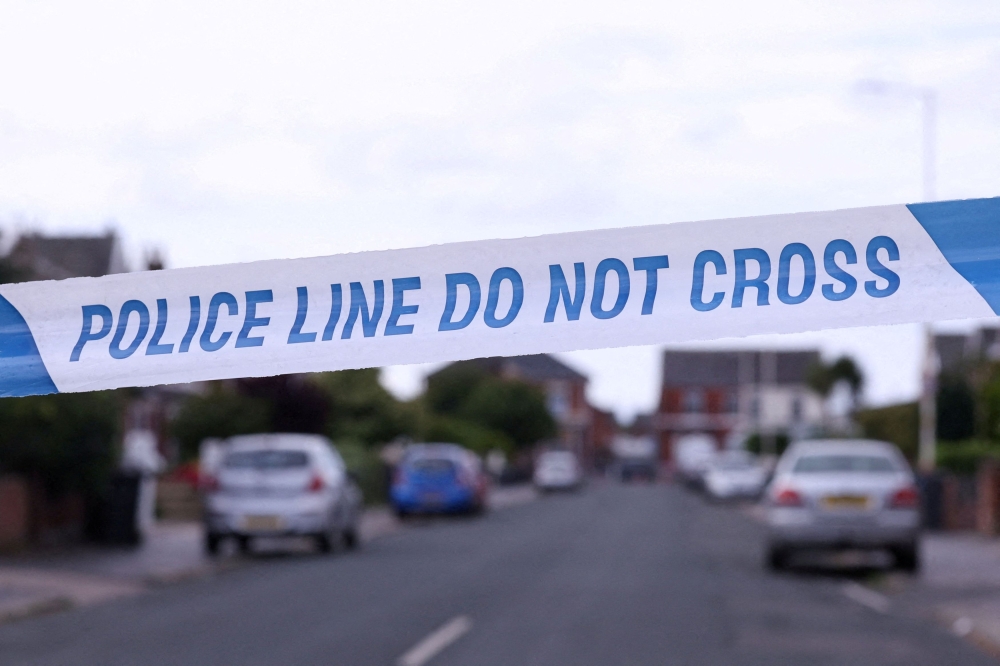 Police tape outlines a perimeter, in Maple street, near a tribute for the victims of a knife attack in Southport August 2, 2024. — Reuters pic  
