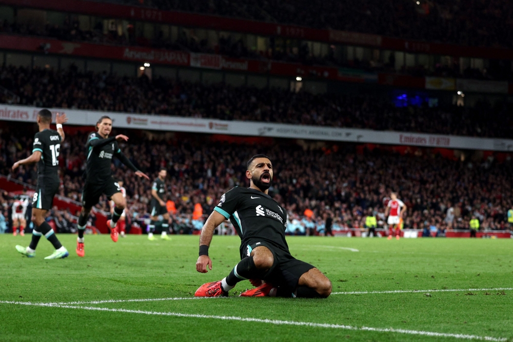 Liverpool’s Mohamed Salah celebrates scoring the team’s second goal during the English Premier League match with Arsenal at the Emirates Stadium in London October 27, 2024. — AFP pic