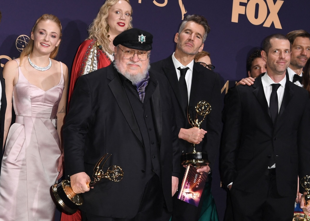 (From left) Actors Sophie Turner, Gwendoline Christie, author George RR Martin, producers David Benioff and DB Weiss pose with the Emmy for Outstanding Drama Series ‘Game Of Thrones’ during the 71st Emmy Awards at the Microsoft Theatre in Los Angeles on September 22, 2019. Could the dragons of Westeros finally be coming to the big screen? — AFP pic