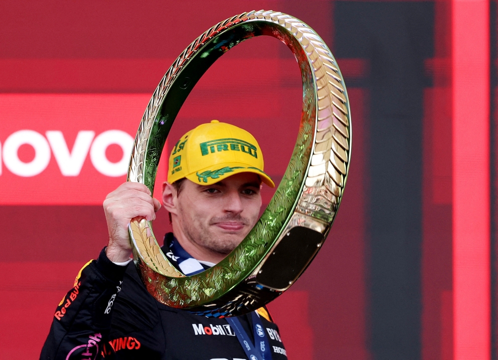 Red Bull's Max Verstappen celebrates on the podium after winning the Sao Paulo Grand Prix. — Reuters