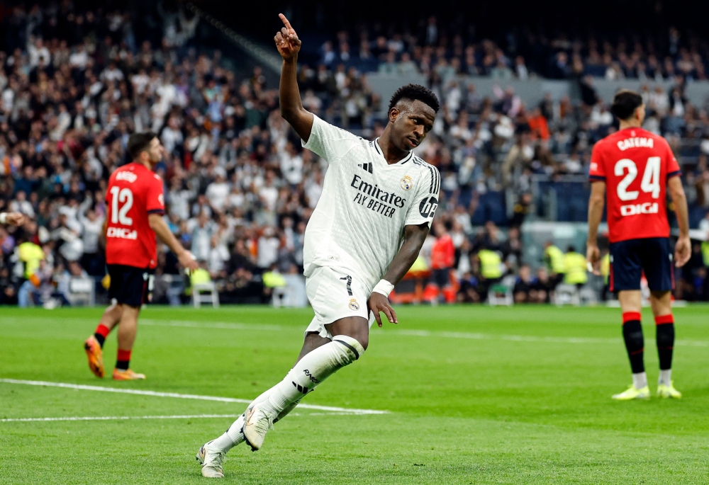 Vinicius Junior scored a hat-trick to help Real Madrid bounce back from two consecutive home defeats with a 4-0 win over Osasuna in La Liga on Saturday. — AFP pic
