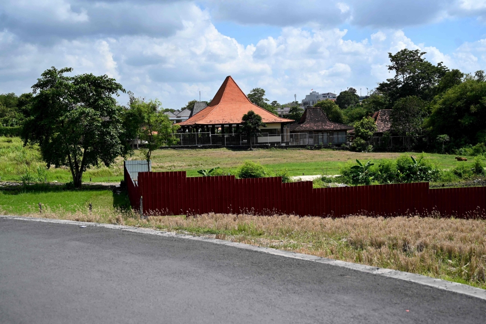 This photo taken on October 22, 2024 shows a villa under construction next to rice fields in Canggu, Badung regency on Bali island. — AFP pic