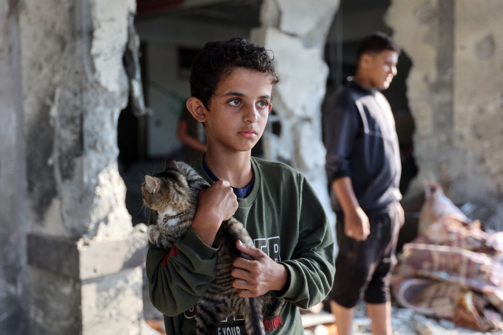 A record 120 million people already live forcibly displaced by war, violence and persecution—most of them inside their own countries, UNHCR figures from June showed. — AFP pic