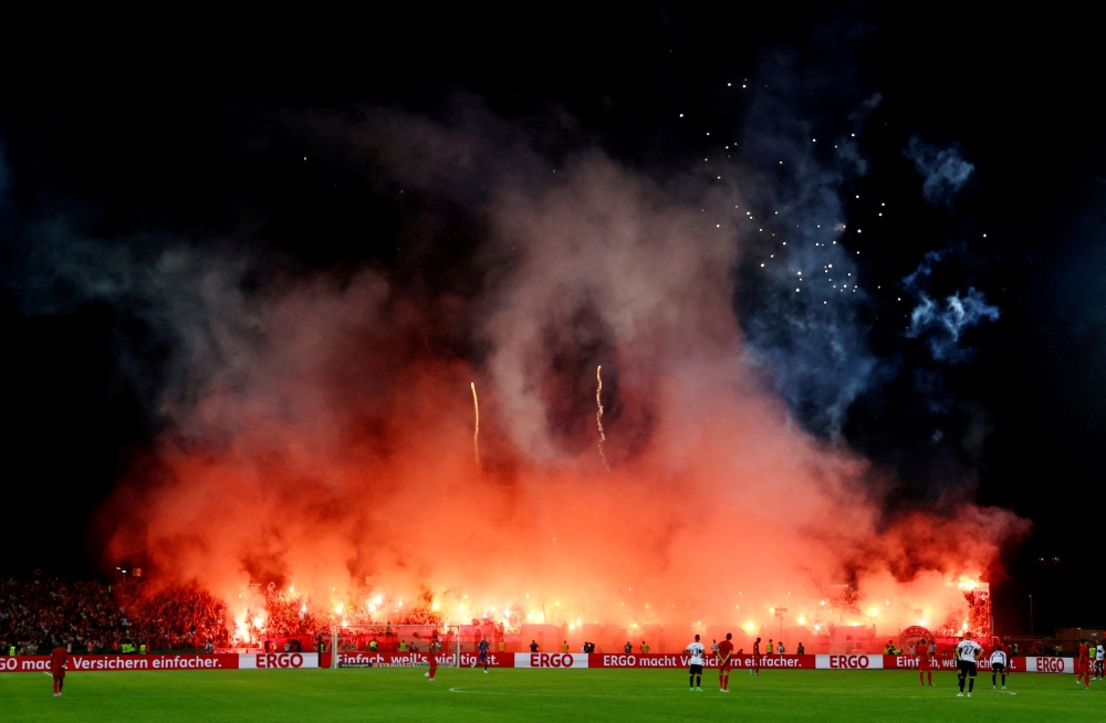 Bayern Munich fans ignited at least 70 flares and four firework batteries during their German Cup win at Ulm in August. — Reuters pic