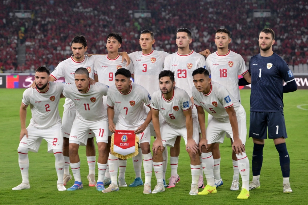 Indonesia's players pose for a team photo before the 2026 FIFA World Cup Asian qualification football match against Australia at Gelora Bung Karno Stadium in Jakarta on September 10. — AFP pic