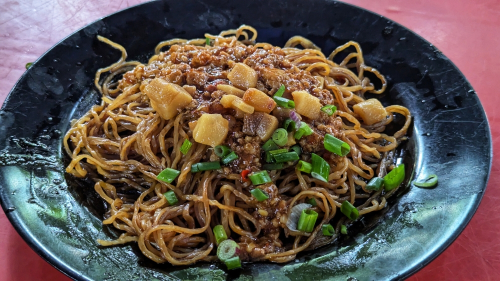 The signature ‘zha jiang’ noodles at Titiwangsa Wang Kopitiam may not look like you expect it to – but it is easy to gobble down seconds or thirds. — Picture by Ethan Lau