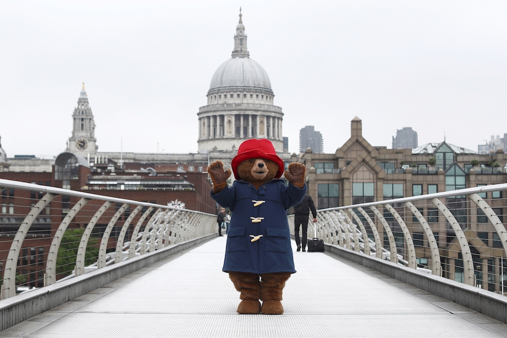 A file photograph shows a performer in a Paddington Bear costume posing in front of St Paul’s Cathedral in London on May 30, 2018. — Reuters pic