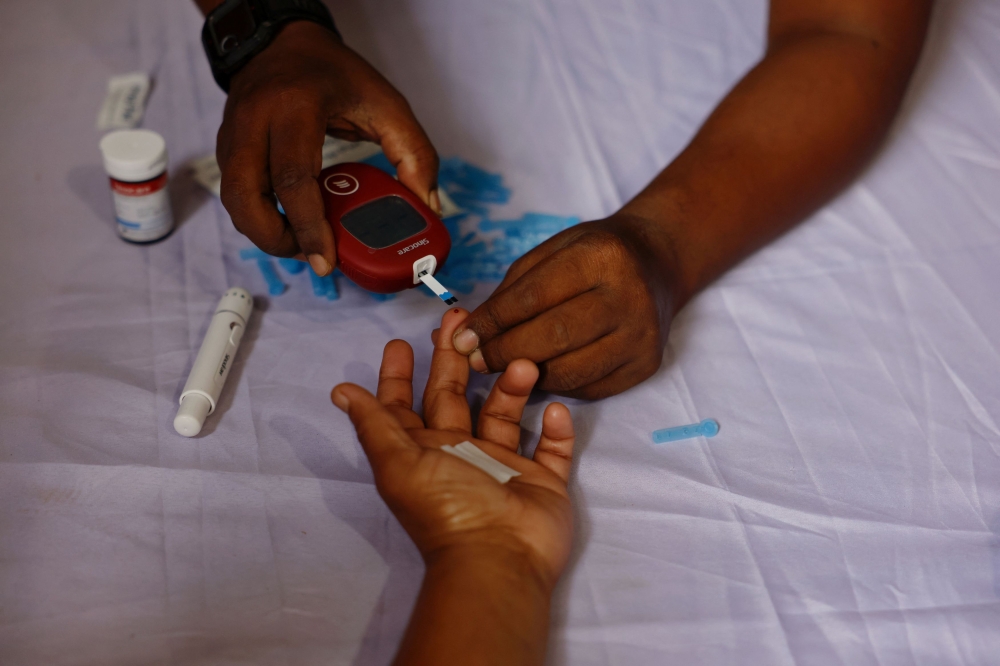 A person receives a free blood sugar test during a campaign to mark the World Diabetes Day in Dhaka, Bangladesh, November 14, 2024. — Reuters pic 