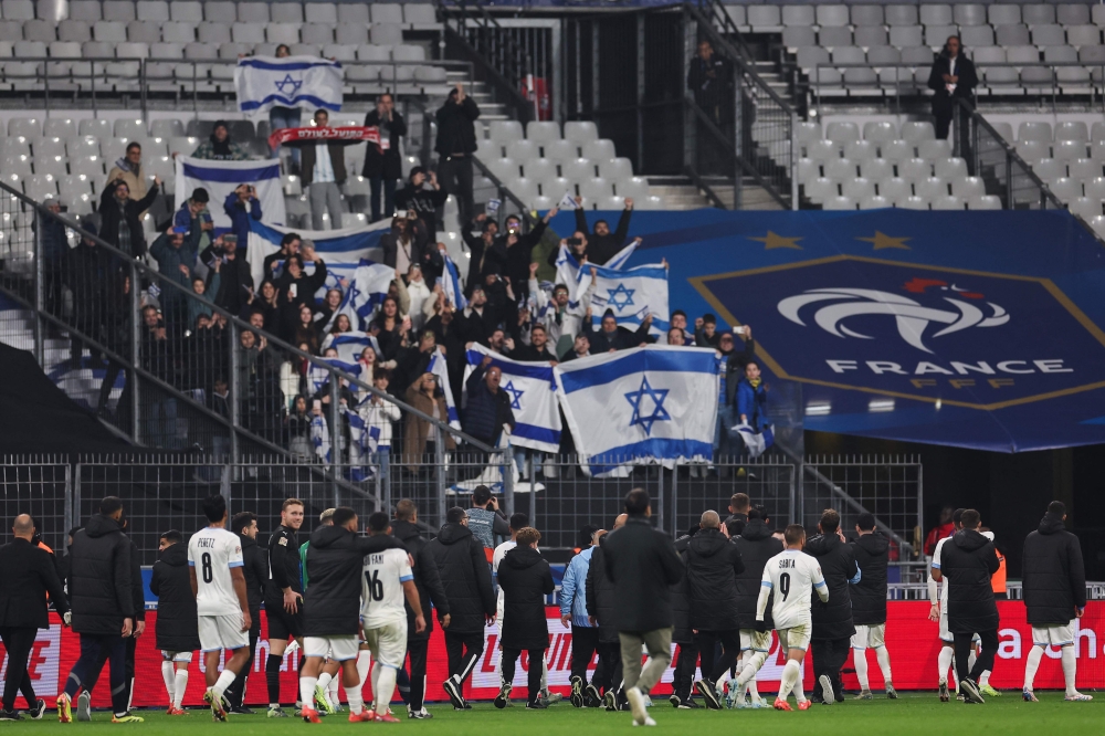 Israel's team greets their supporters at the end of the UEFA Nations League League A, Group A2 football match between France and Israel at The Stade de France stadium in Saint-Denis, in the northern outskirts of Paris, on November 14, 2024. — AFP pic