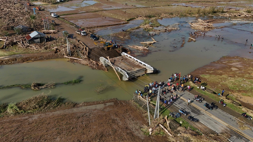 This handout photo taken on November 15 shows an aerial view of a destroyed bridge in Gonzaga town, Cagayan province, a day after Typhoon Usagi hit the province. — AFP pic