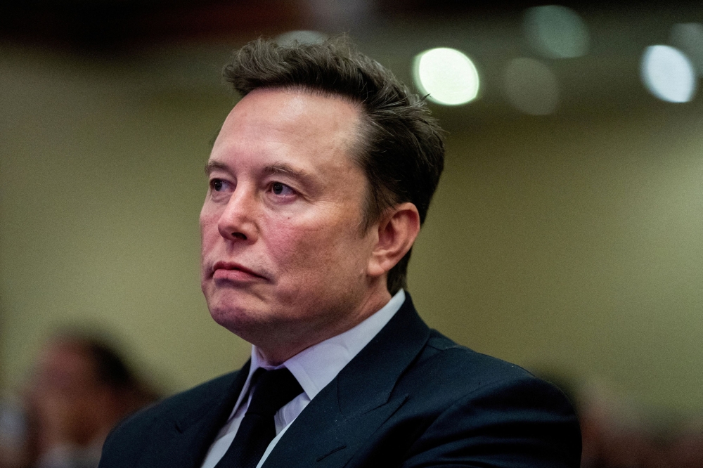 X owner Elon Musk’s sweeping changes to the platform, including laying off many people who worked to moderate content, and one of his posts on X, scared away advertisers and hit revenues. That reduced the value of the debt, as the risk of default increased. — Reuters pool pic