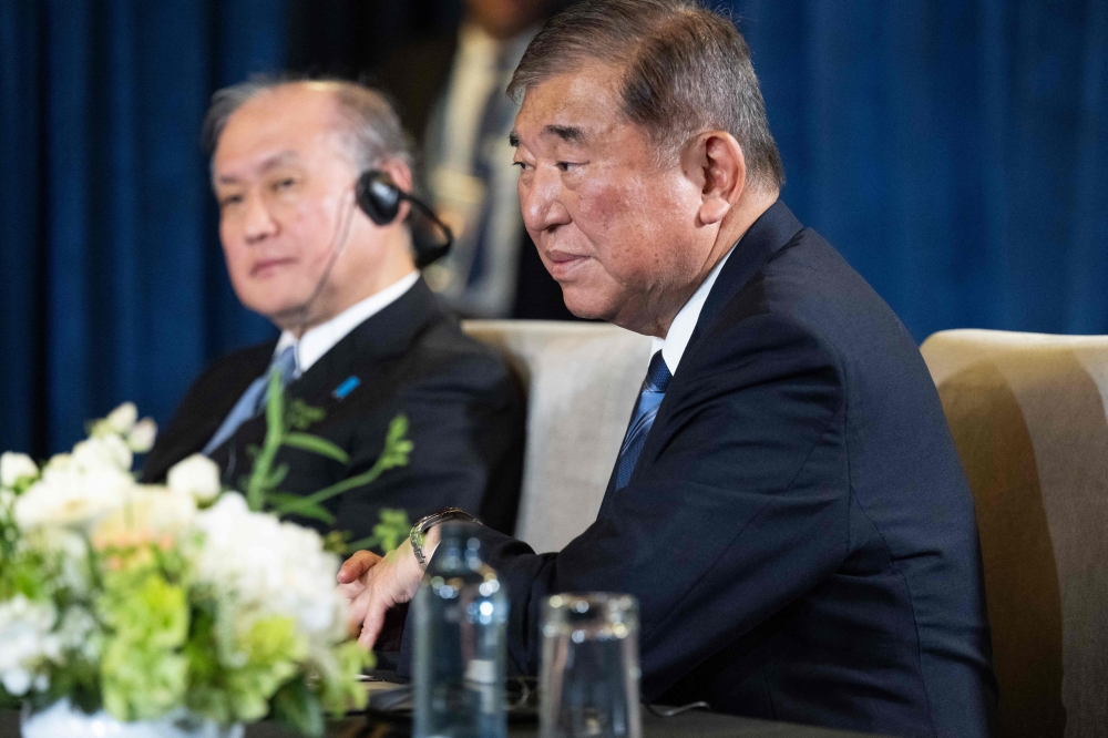 Japanese Prime Minister Shigeru Ishiba ‘conveyed serious concerns over the Chinese military’s growing activity’ to Xi, the Japanese foreign ministry said. — AFP pic
