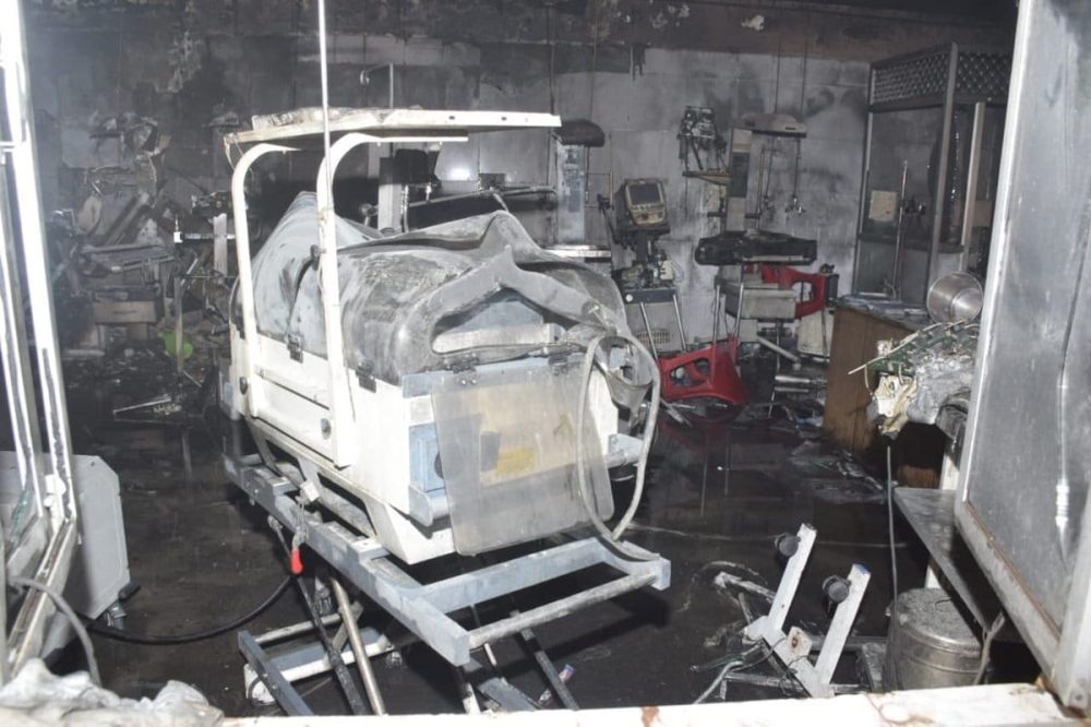 Footage from the scene showed charred beds and walls inside the ward as a crowd of anguished families waited outside. — Social media picture