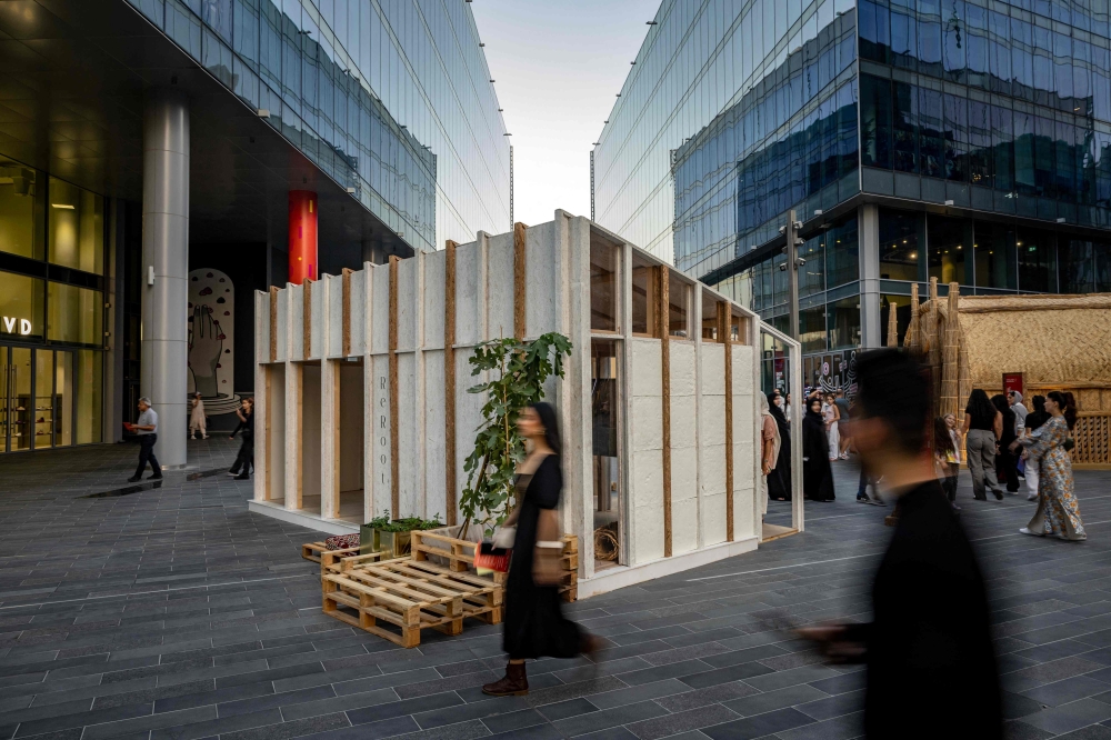 Visitors walk past a mycelium-based modular shelter, designed by the ReRoot initiative, as an alternative to the flimsy shelters now housing many thousands of Gazans displaced by more than a year of war, during the annual Design Week in Dubai on November 9, 2024. Mycelium, the root-like part of a fungus, can be grown in combination with organic matter to fit different-shaped moulds, producing a strong building material that can be cultivated anywhere. — AFP pic