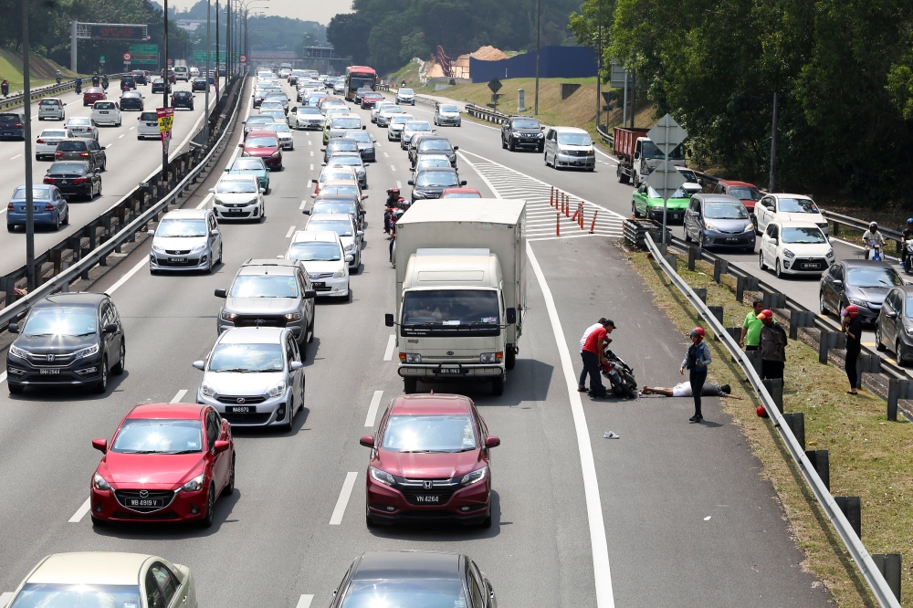 A file picture of accident involving a motorcyclist on the Federal Highway. — Picture by Yusof Mat Isa