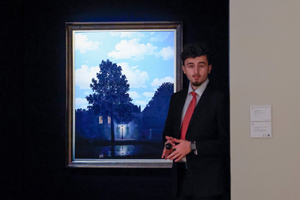 Rene Magritte’s ‘L’empire des lumires” is on display during a press preview for Christie’s Fall 20/21 Marquee Week in New York on November 8, 2024. — AFP pic