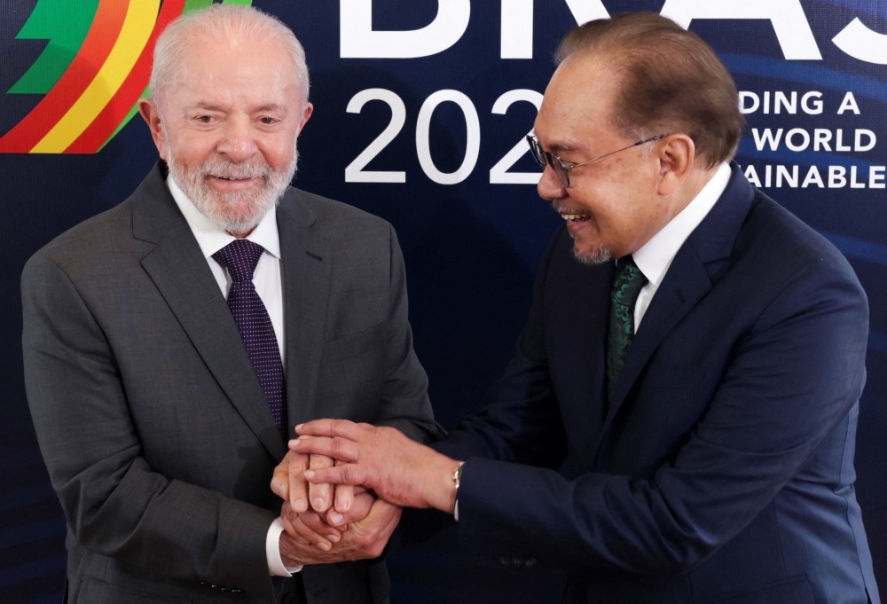 Brazil’s President Luiz Inacio Lula da Silva shakes hands with Malaysian Prime Minister Anwar Ibrahim, ahead of the G20 summit, in Rio de Janeiro, Brazil, November 17, 2024. — Reuters pic